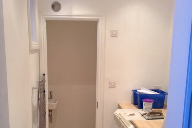 A simply finished under-stairs toilet and utility to give that extra space