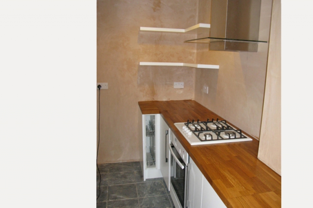 We maximised the space of this kitchen refit, insulated and plastered the walls and ceiling ready for painting