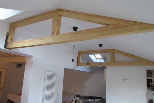 Hip roof extension with exposed trusses. Bishopston, Bristol